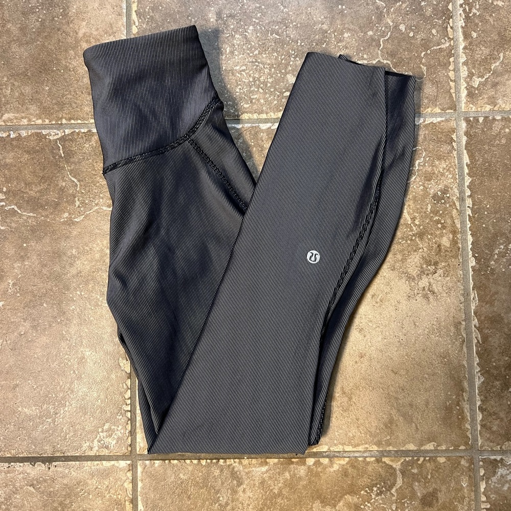 Lululemon leggings size 0. Never before worn, black and grey